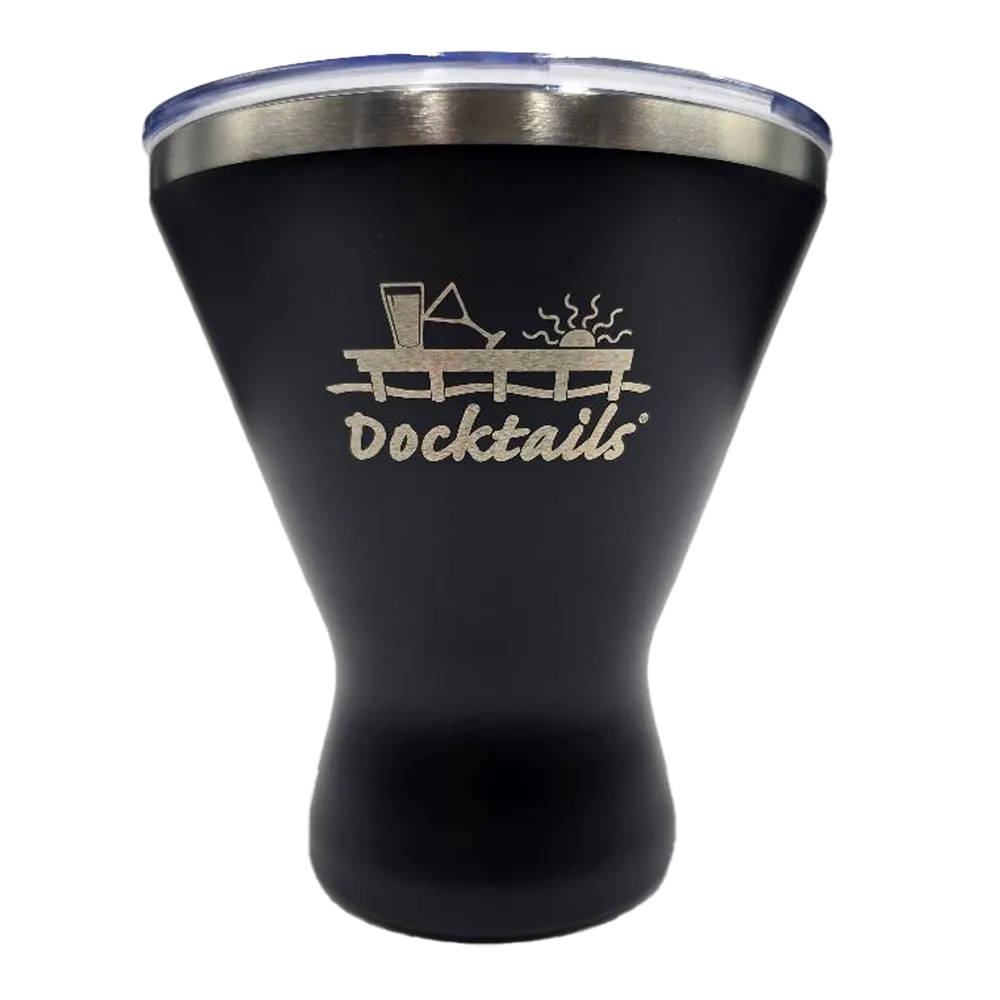 A black insulated tumbler with a clear lid and a silver stainless steel rim, featuring a laser-engraved graphic of a dock with a drink and the word 'Docktails' on the front.