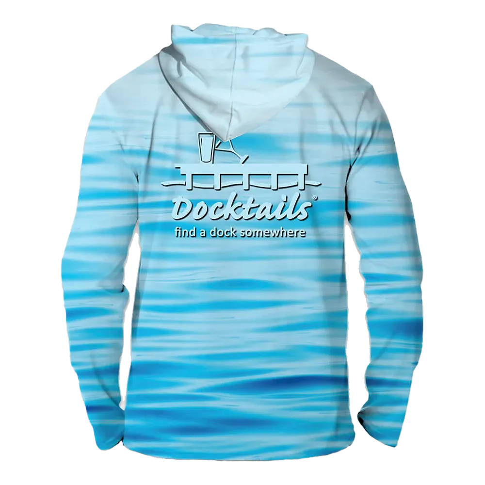 A long-sleeve hooded shirt with a blue and white water-wave pattern, featuring a white graphic on the back with a cocktail glass and the text 'Docktails' and 'find a dock somewhere'.
