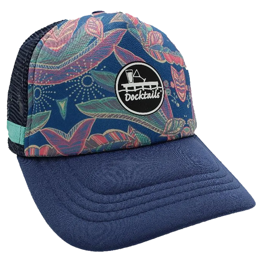 Navy blue trucker hat with floral main panel, navy mesh side panel with a turquoise fabric band, and a black Docktails logo patch on the crown.