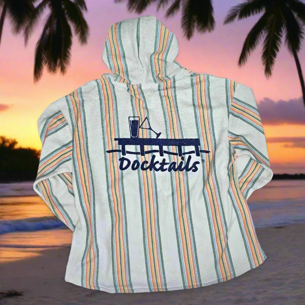 A hooded long-sleeve hoodie with vertical stripes in orange, green, and blue on a white base, featuring a dark blue 'Docktails' graphic on the back. The hoodie is displayed against a beach sunset background with palm trees.