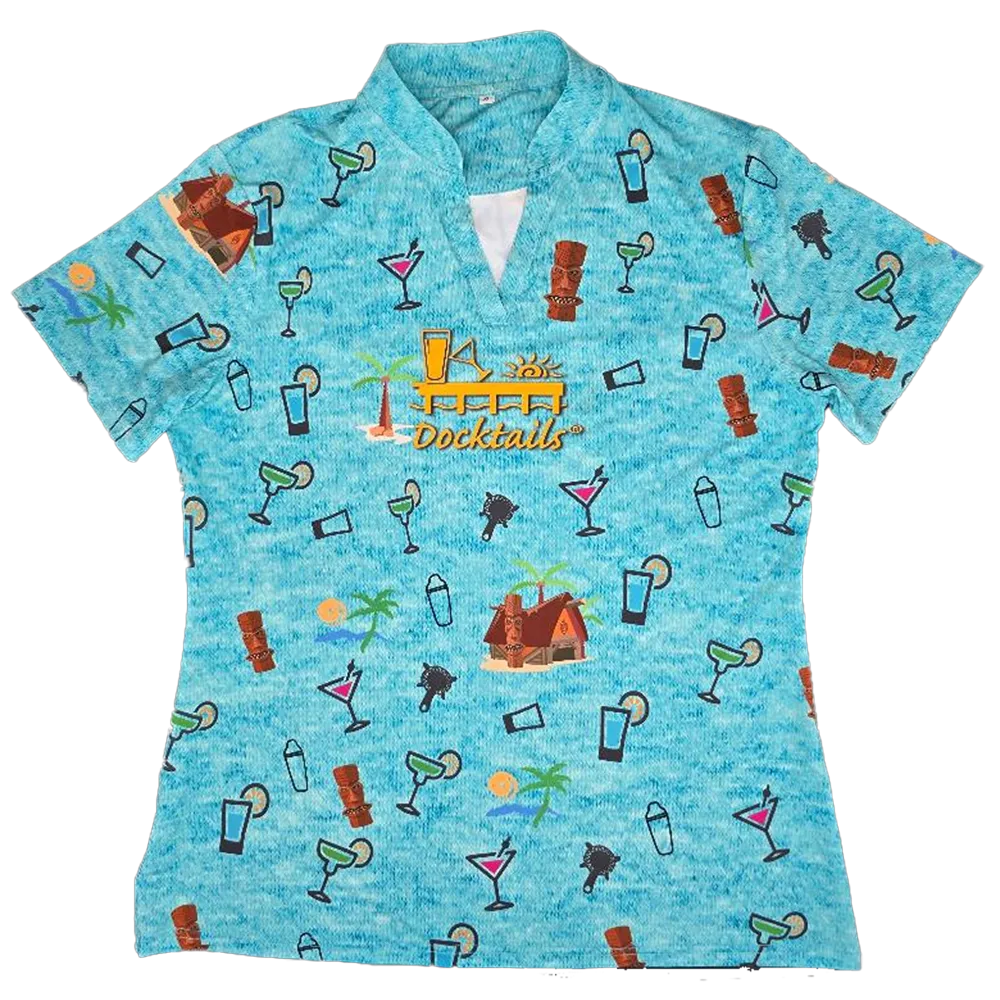 A women's short-sleeve collared golf polo shirt in a heathered light blue color, featuring an all-over tropical cocktail and beach hut pattern. The center chest features a yellow and orange graphic that reads 'Docktails'.