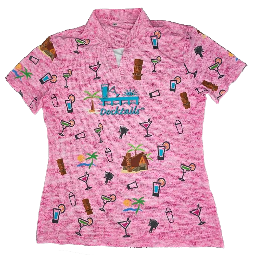 A women's short-sleeve collared polo shirt in a heathered pink fabric, featuring an all-over tropical cocktail and beach-themed print with a central 'Docktails' logo.